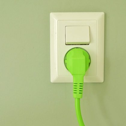 socket-with-green-plug-on-green-wall-paper-2022-11-02-19-10-53-utc